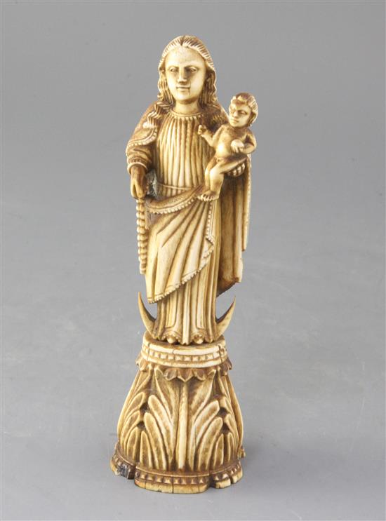 An Indo-Portuguese ivory group of the Virgin and Child, height 7.5in.
